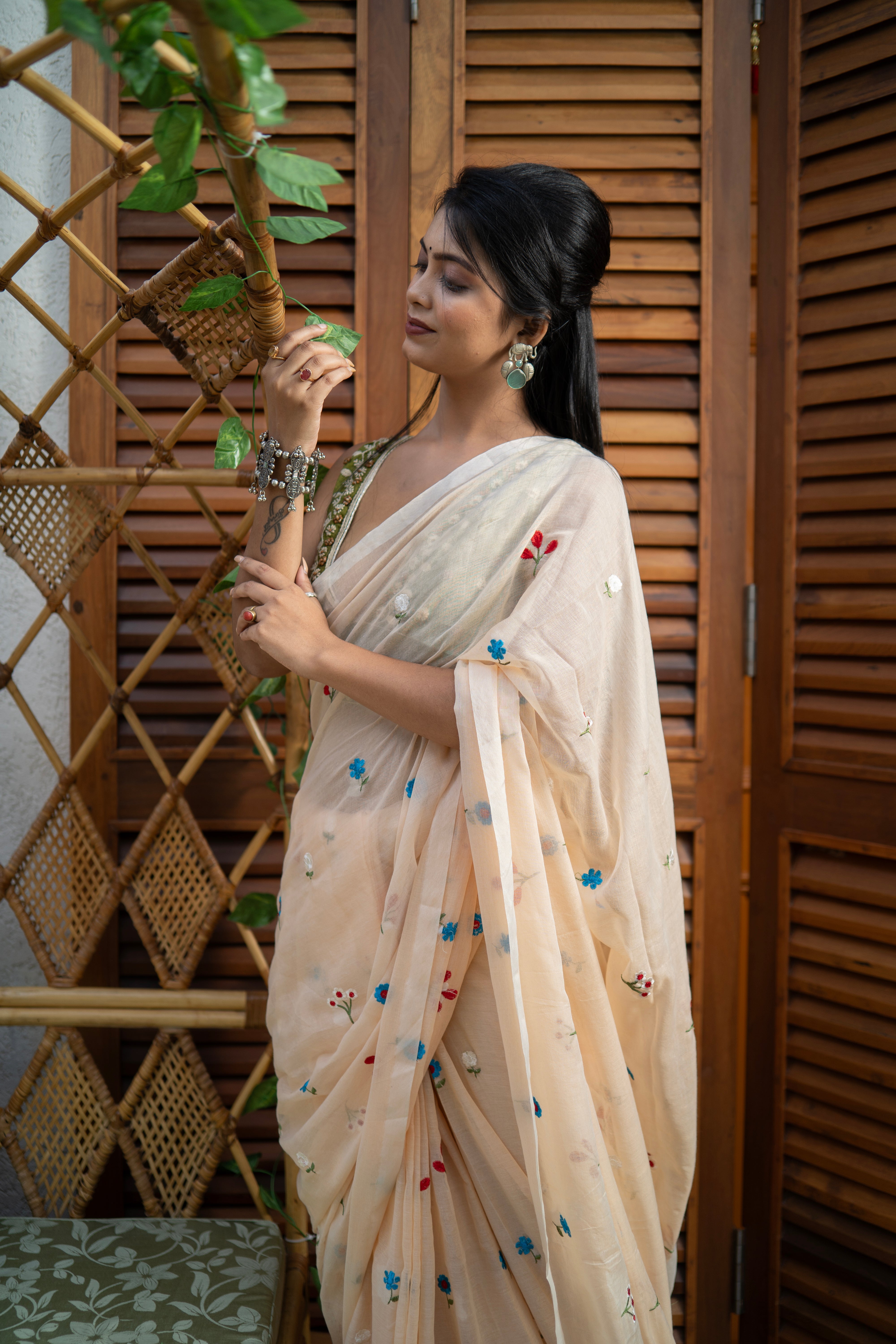Cream embroidered mulmul cotton saree